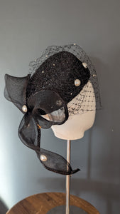 The Girl with the Black and Pearl Pill Box