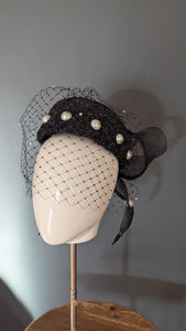 The Girl with the Black and Pearl Pill Box