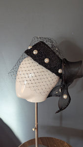 The Girl with the Black and Pearl Pill Box