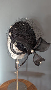 The Girl with the Black and Pearl Pill Box