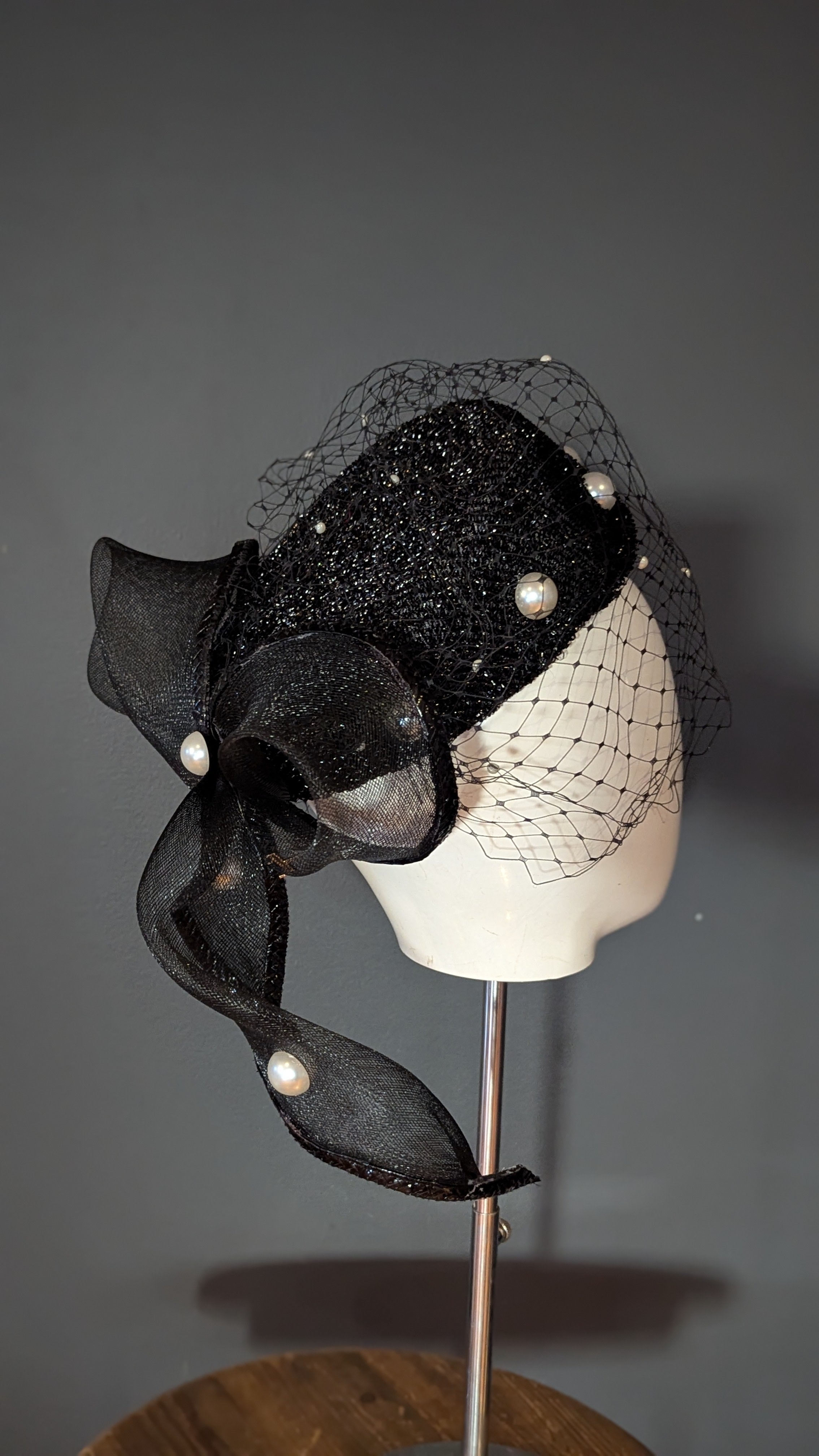 The Girl with the Black and Pearl Pill Box
