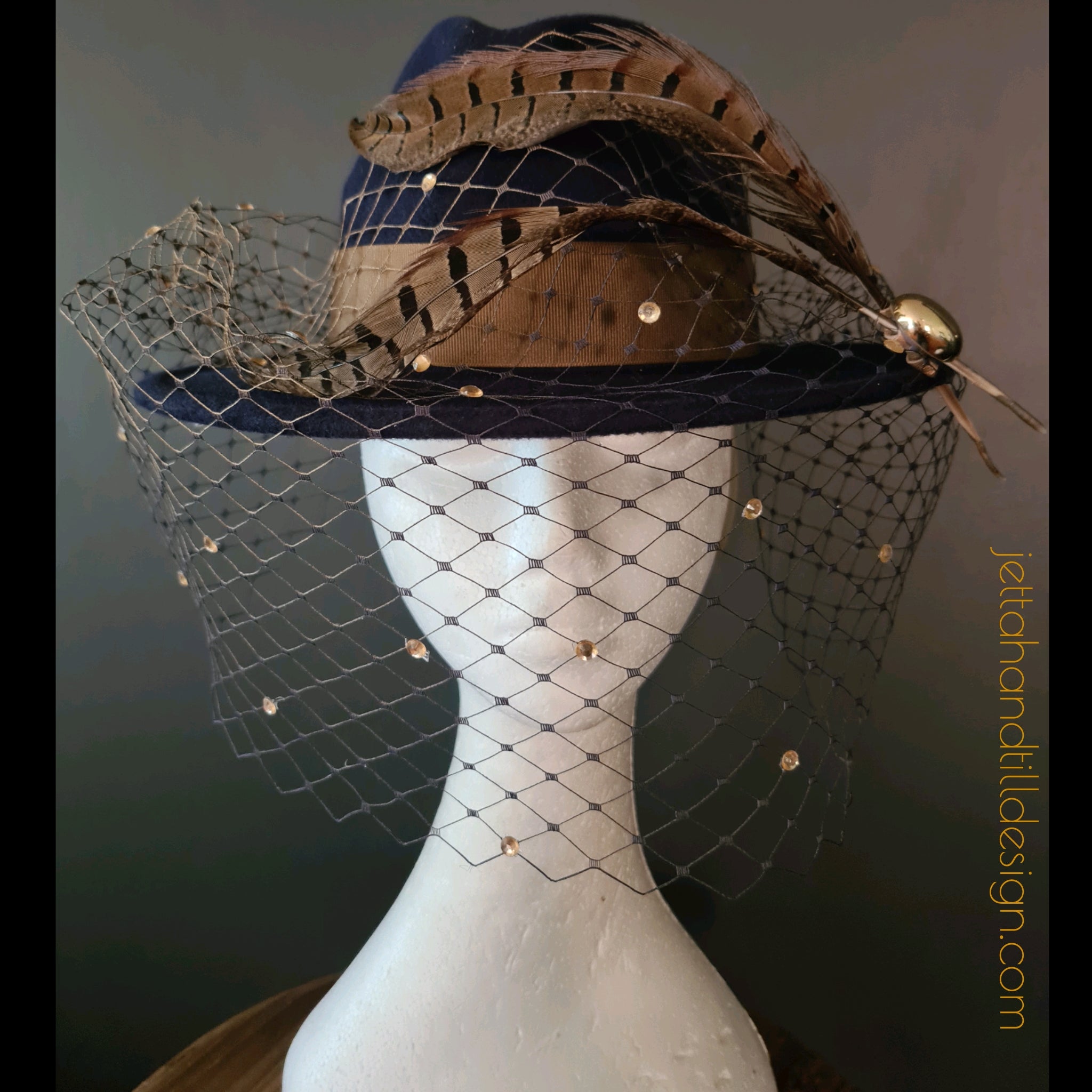 Navy felt fedora with soft brown amherst feathers and ombre navy gold diamonte veiling