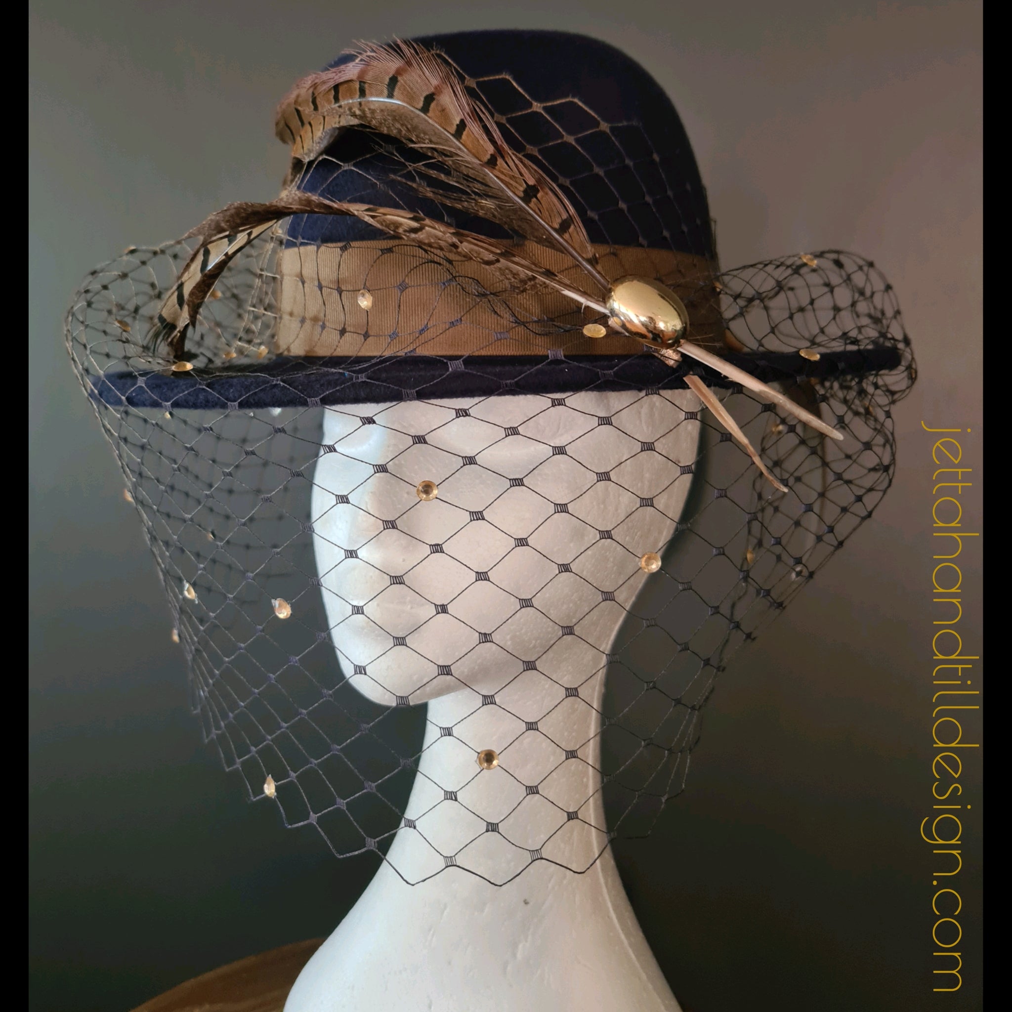 Navy felt fedora with soft brown amherst feathers and ombre navy gold diamonte veiling