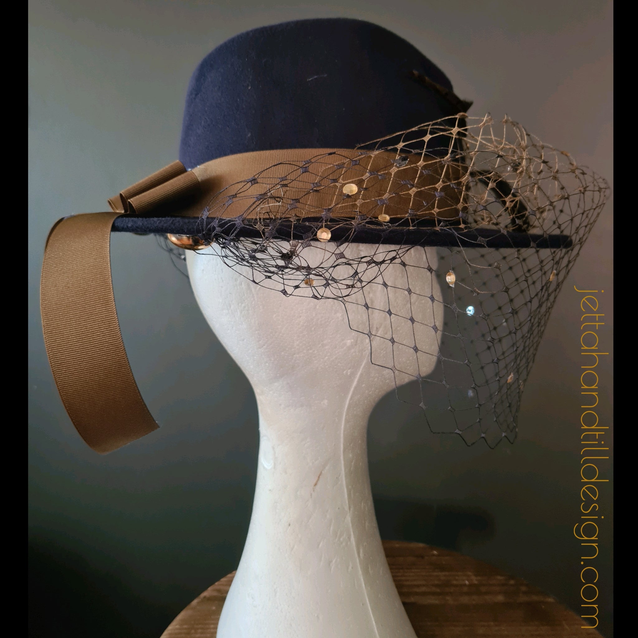 Navy felt fedora with soft brown amherst feathers and ombre navy gold diamonte veiling