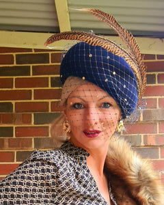 Navy felt veiled vintage blocked hat with sculpted tan feathers