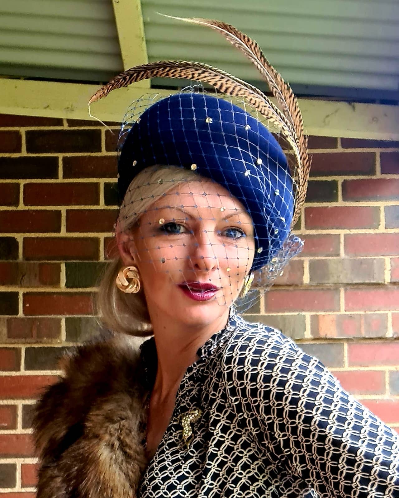 Navy felt veiled vintage blocked hat with sculpted tan feathers